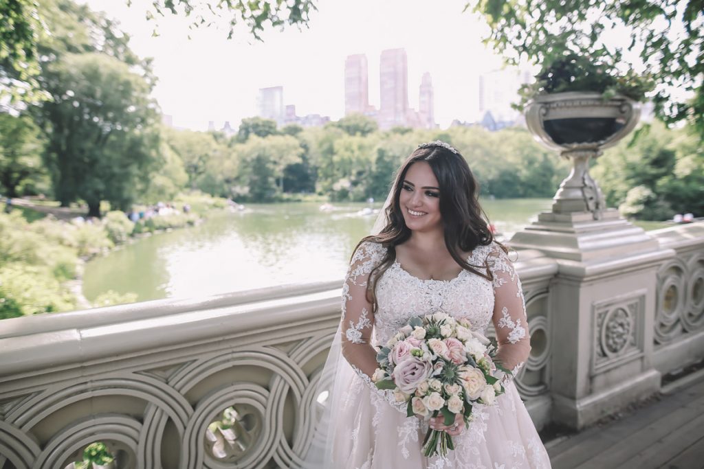 summer wedding central park on bow bridge brazilian bride with flowers 1